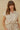 Rita Shirt cream beige striped tie-front blouse with rolled sleeves and relaxed fit.