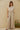 Rita Shirt lightweight striped top styled with wide-leg pants in soft neutral tones.