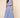 Ritzi Blouse front detail of vertical blue stripes, one shoulder crop top and soft drape fabric on model