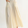 Roblen Pant soft cream wide-leg pants close-up of oversized pocket design and lightweight textured fabric.