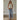 Woman styling the off white Romett Top with light-wash jean skirt, showcasing the fitted ribbed silhouette, cropped length, and minimalist everyday style.