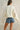 Back view of Rope USA Knit Sweater in off white with relaxed cropped fit.