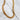 Rron Necklace by Matte, gold filled beaded chain necklace on marble background