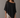 Rueth Poncho black lightweight poncho top with subtle shimmer, relaxed draped silhouette, and asymmetrical pointed hem for an elegant, flowing shape.