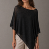 Rueth Poncho black lightweight poncho top with subtle shimmer, relaxed draped silhouette, and asymmetrical pointed hem for an elegant, flowing shape.