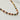 Sabrina Necklace by Matte, multicolor beaded gold plated necklace on white surface
