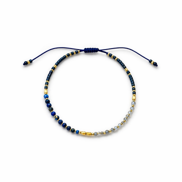 Sarka Bracelet flat lay showing navy beads, gold details, crystal accents, and sliding adjustable closure.