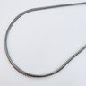 Sawyer necklace by Matte, silver tone gold plated herringbone chain on white background
