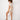 Model wearing Seaside PJ Set in beige and blush coastal print — Matte Concept Store