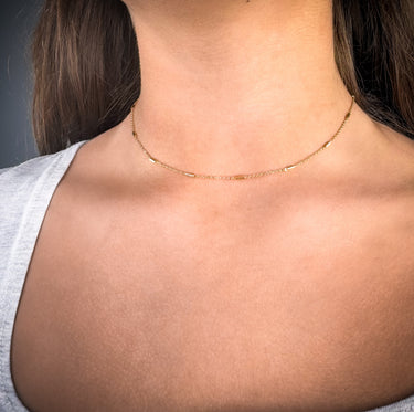 Model wearing Sequence gold filled chain necklace by Matte, delicate minimalist jewelry