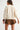 Back view of the Sienu Sweater in cream featuring the oversized silhouette, cape sleeves, and clean minimalist design.