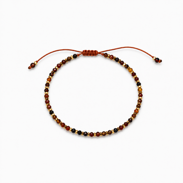 Sigma Bracelet with earthy brown micro beads and adjustable cord closure displayed on a neutral background.