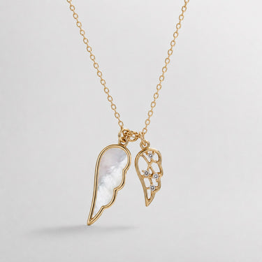 Sola Wings Necklace gold double-wing pendant with mother-of-pearl accents on delicate chain.
