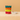 Stack of colorful star-shaped rings on a beige background
