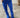 Close-up of Stones Pant showing mid waist and flared leg in electric blue.