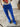 Close-up of Stones Pant showing mid waist and flared leg in electric blue.