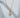 Sunny Necklace by Matte, gold plated sun pendant with rays on chain, shown on white sculptural background