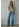 Talina lightweight grey knit cardigan featuring a relaxed fit, soft knit fabric, and button-front design, styled with blue denim.