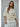 Talina lightweight ivory knit cardigan with a relaxed fit, elbow-length sleeves, button-front closure, and rolled-edge finish, shown from the front.