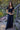 Full-body view of the Tamara Top in black paired with a flowing black maxi skirt, showcasing the fitted ribbed crop top, scoop neckline, and versatile everyday styling.