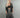Woman wearing The Carol Set with black lace crop top and sheer lace jacket, front view.