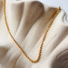 Together Necklace by Matte, gold plated ball chain on ceramic surface