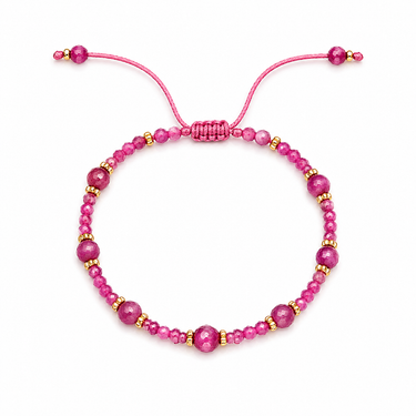 Tral Bracelet adjustable magenta faceted beaded bracelet with gold-tone accents on neutral background.