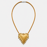 Tria Necklace featuring a textured gold heart pendant on a sleek golden cord necklace against a white background.