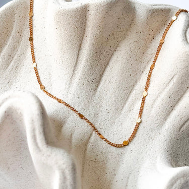 Trix gold plated beaded chain necklace by Matte, displayed on neutral background