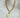Twinkle Necklace by Matte, 16-inch gold plated chain with star chunky pendant on neutral background