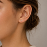 Model wearing Udhi 4 mm crystal stud earrings for a minimalist everyday look.