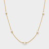 Veru Necklace featuring luminous pearl accents spaced along a delicate gold chain with adjustable extender.