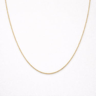 Gold chain necklace on a white background