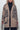 Relaxed fit leopard cardigan styled open with casual outfit and sneakers.