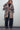 Full body view of Wild Muse Leopard Cardigan worn over turtleneck and wide-leg pants.