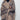 Model styling the Wild Muse Leopard Cardigan open over black turtleneck and pants.
