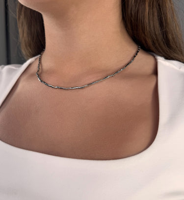 Model wearing Willow Necklace by Matte, silver rectangular link chain, 16 inch