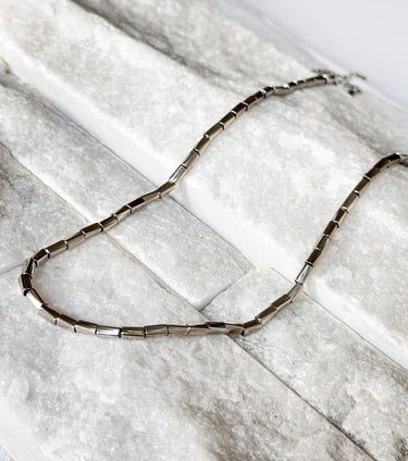 Willow Necklace by Matte, silver rectangular link chain on marble surface
