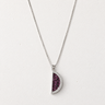 Zaromi Necklace featuring a silver-tone chain with a reversible half-moon pendant showcasing sparkling cubic zirconia on one side and vibrant pavé stones on the other, styled on a light neutral background for everyday layering.