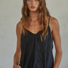 Zia Top black camisole with relaxed fit and spaghetti strap design.